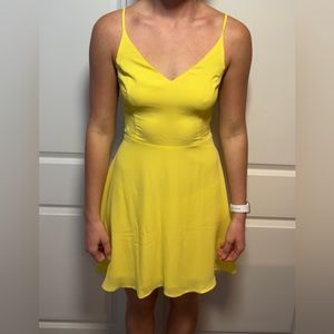 Yellow flowy dress with a tie up back